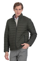 Dark olive green quilted puffer jacket with a stand-up collar and front zipper.
