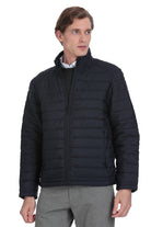 Black quilted puffer jacket with a high collar and front zipper.