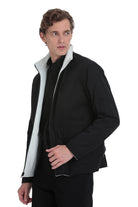 Black puffer jacket with a contrasting white fleece-lined collar and zipper trim.