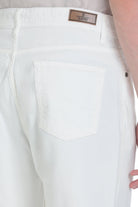 Regular fit white cotton denim pants showing the back waistband with a brown sayki leather brand patch