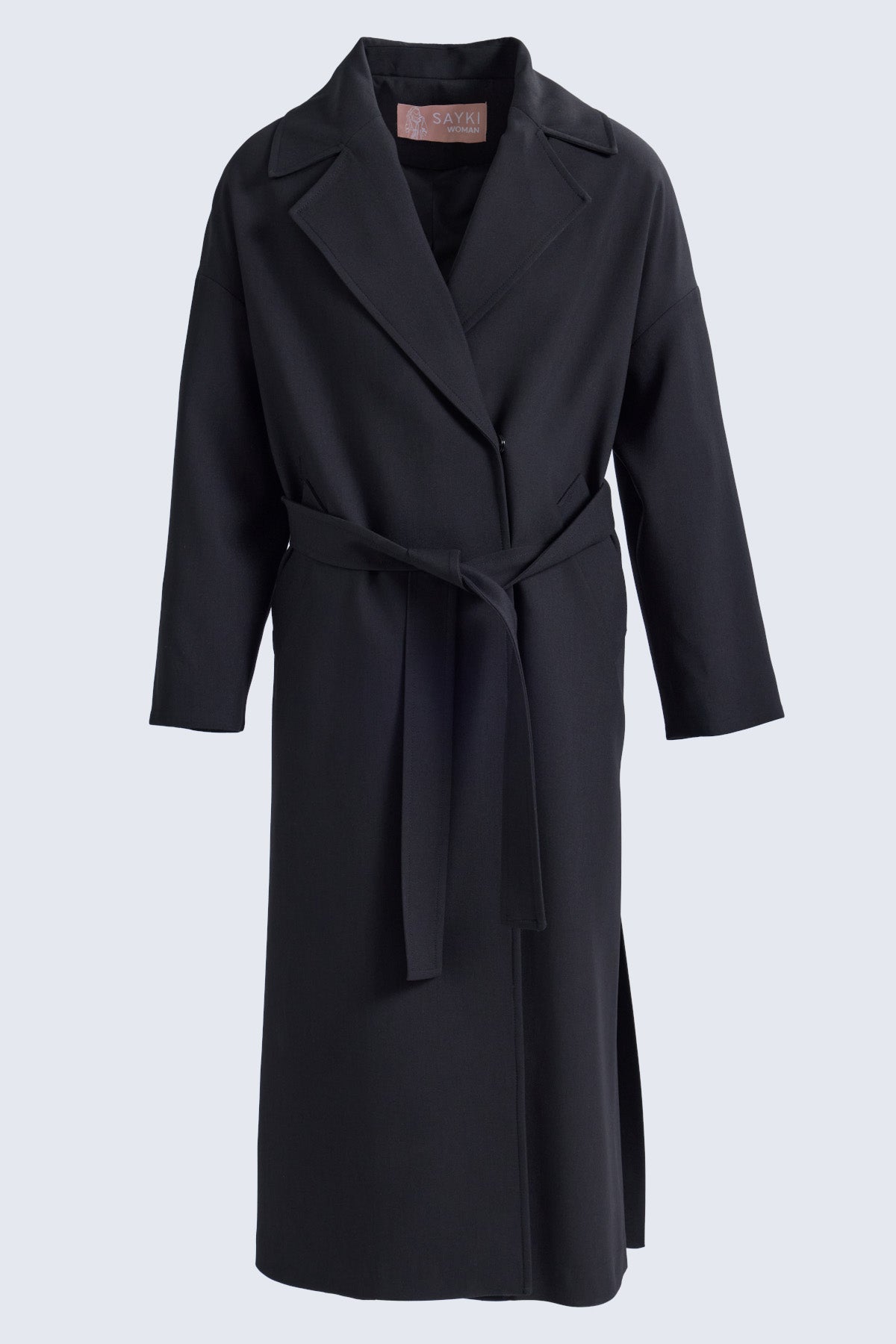 Black belted trench coat with structured collar and long sleeves from sayki woman dynamic fit oversized coat collection