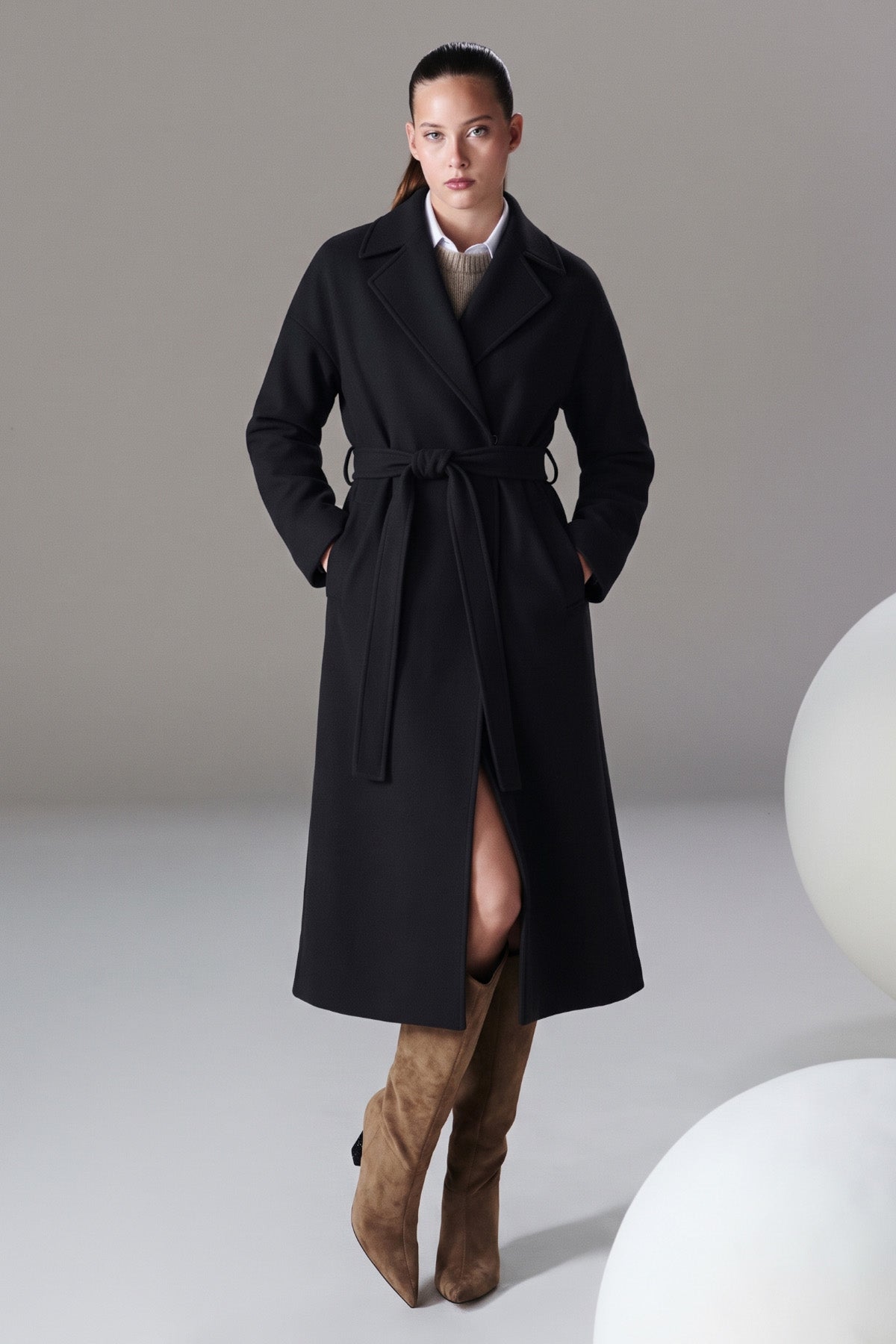 Black wool trench coat with belted waist and classic collar from sayki woman dynamic fit oversized collection
