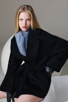 Black belted coat with wide sleeves and soft structured silhouette in sayki woman dynamic fit cachet black oversized short coat