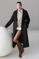 Black wool coat with classic collar and long sleeves from sayki woman dynamic fit cachet brown oversized coat collection