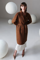 A rich brown belted wool coat with double-breasted design and plush texture in sayki woman dynamic fit style