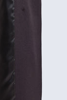 Dark gray fabric with subtle texture and visible stitching on sayki woman dynamic fit double-breasted wool blend coat
