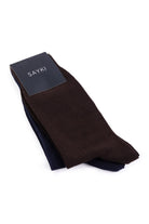 A pair of dark brown and navy blue crew socks from sayki, neatly folded with a branded tag.