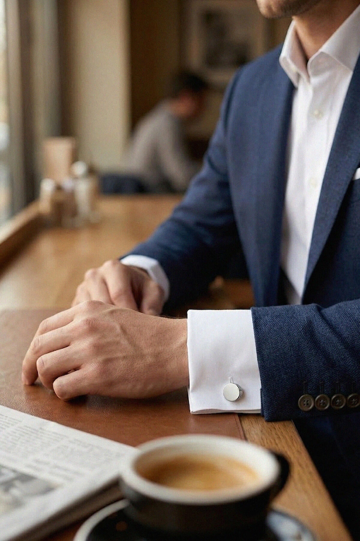 Navy blue textured suit jacket with white dress shirt featuring silver toned natural stone round cufflinks
