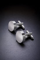 Silver toned natural stone round cufflinks shaped like engine pistons with polished metallic finish and three ridges