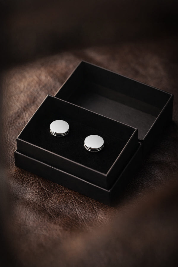 Silver toned natural stone round cufflinks with minimalist circular design and subtle horizontal grooves
