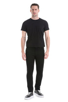 Black slim-fit trousers with a sleek, modern cut and subtle stitching details.