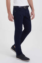 Navy blue slim-fit trousers with a subtle texture and belt loops