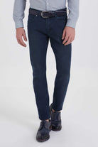 Dark blue slim-fit denim jeans with a classic five-pocket design and belt loop detailing.