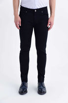 Black slim-fit jeans with a classic five-pocket design and silver-toned button closure.