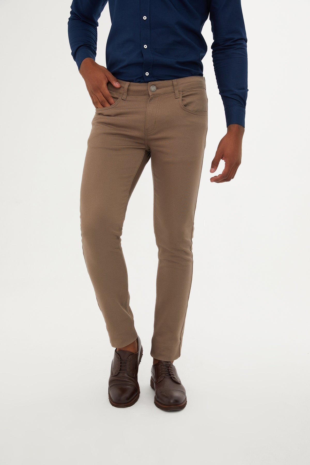 Beige slim-fit chino pants with a classic five-pocket design and button closure.