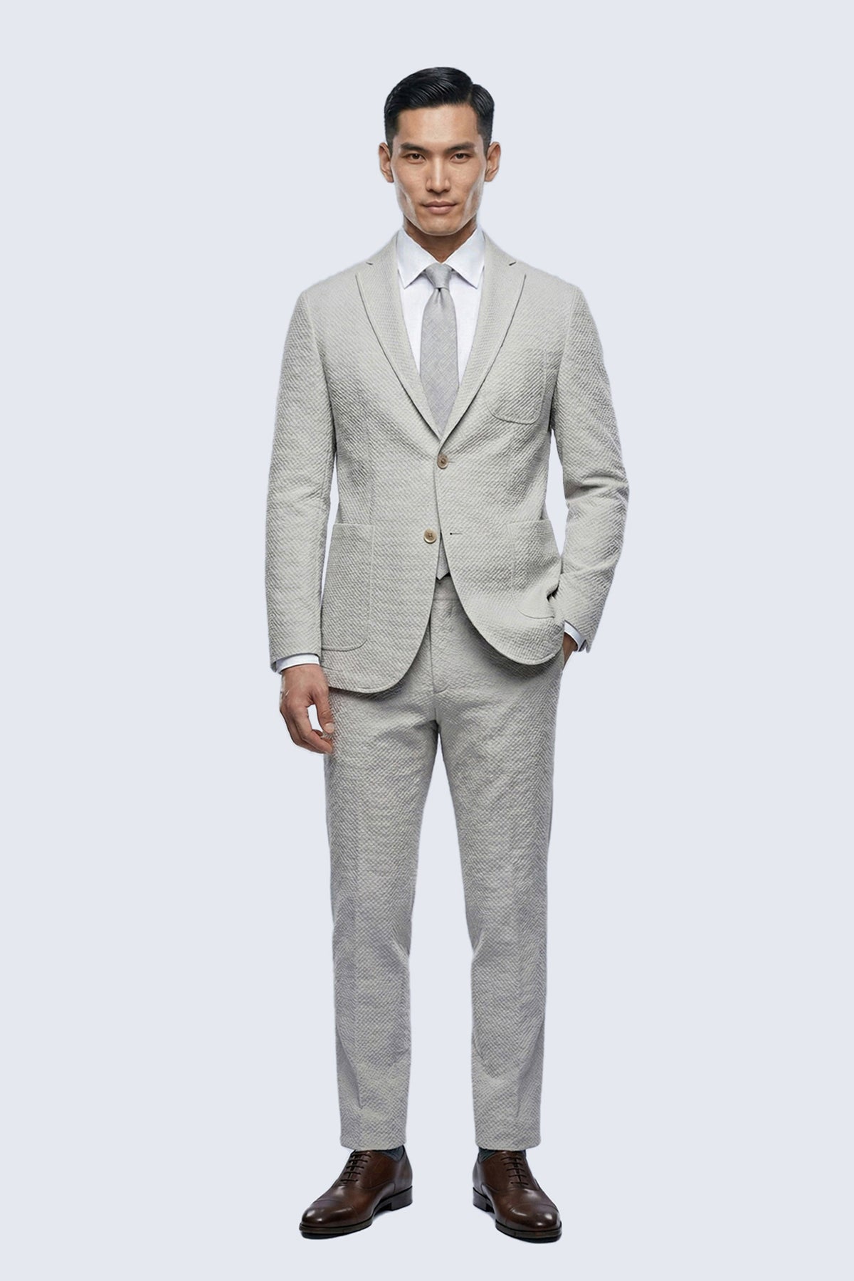 Slim fit beige notch lapel classic blazer in light gray textured fabric with subtle pattern and matching slim fit trousers