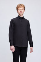 Black long-sleeved button-up shirt with a crisp collar and subtle sheen.