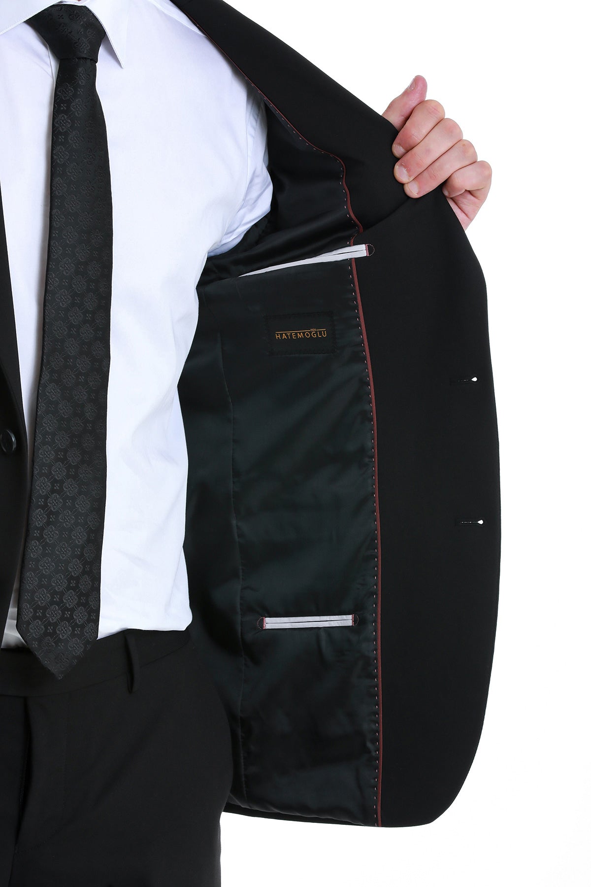 Slim fit black peak lapel tailored blazer with subtle red stitching and satin-lined interior by kate middleton