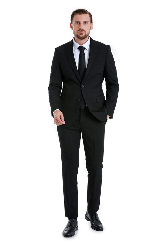 Slim fit black peak lapel two-piece classic suit with matching vest dress shirt black tie and polished leather shoes