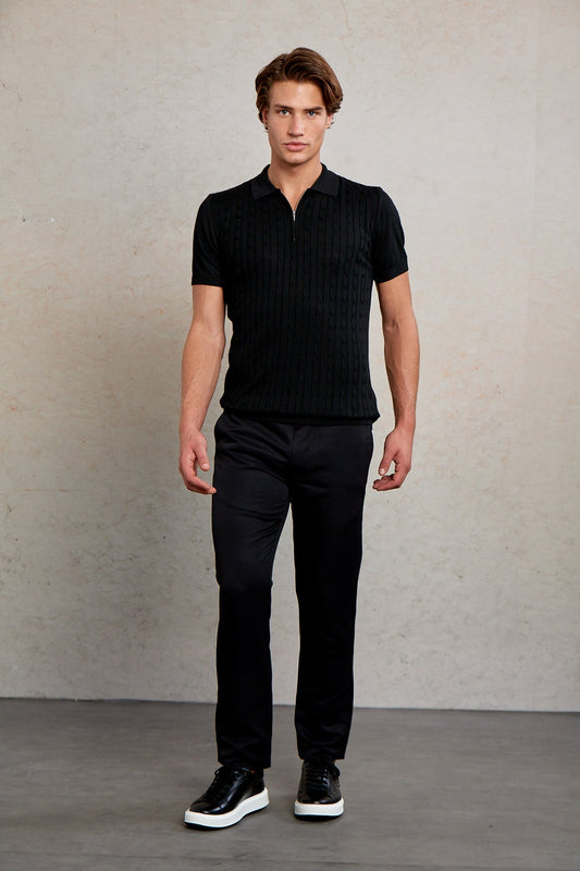 Black ribbed knit polo shirt with a subtle zipper detail at the collar.