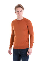 A men’s orange crewneck sweater with ribbed cuffs and hem, made of a soft knit material.