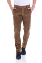 Brown corduroy trousers with a classic, slim-fit cut.