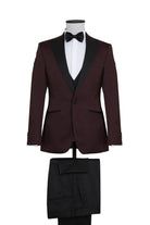 A maroon tuxedo suit with black satin lapels and matching trousers, featuring a subtle textured pattern on the jacket.