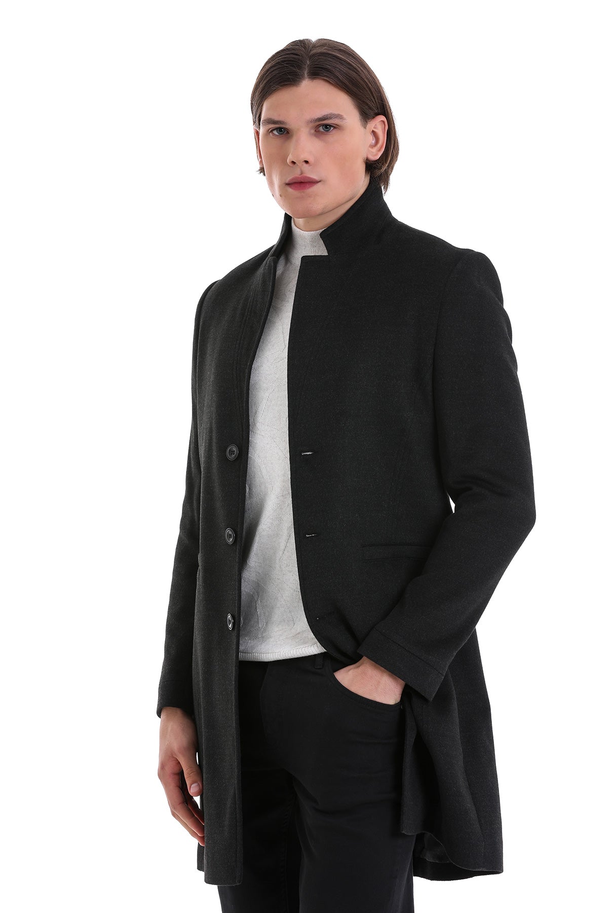 Black woolen overcoat with a stand-up collar and front button closure.