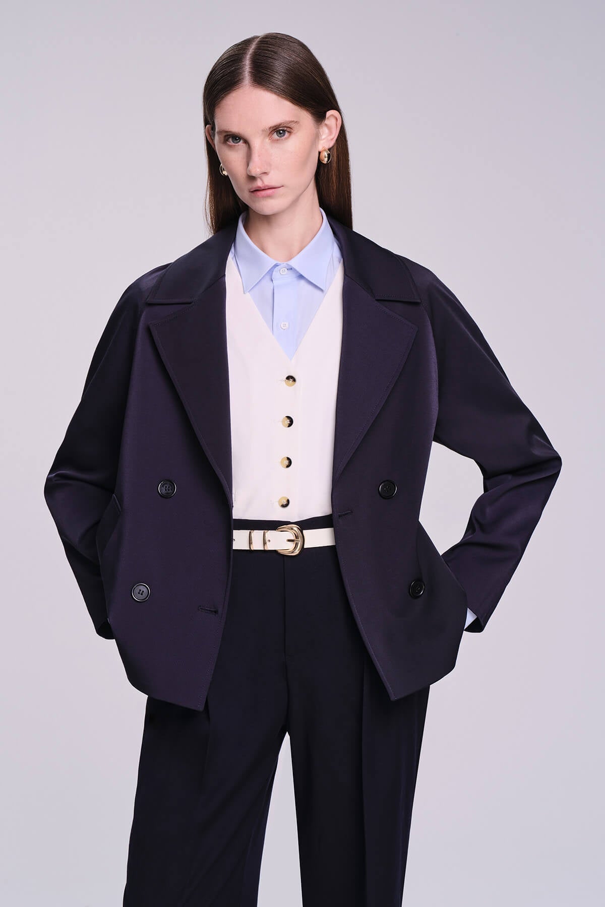 Navy blue double-breasted blazer with gold-toned buttons and structured lapels