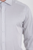 A crisp white dress shirt with a subtle gray dot pattern and classic button-down collar.