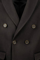 Black double-breasted coat with gold-toned, ornate buttons.