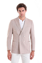 Beige double-breasted blazer with a subtle textured weave and white buttons.