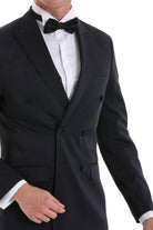 Black slim fit double breasted tuxedo jacket with notched lapels and matching bow tie for formal occasions