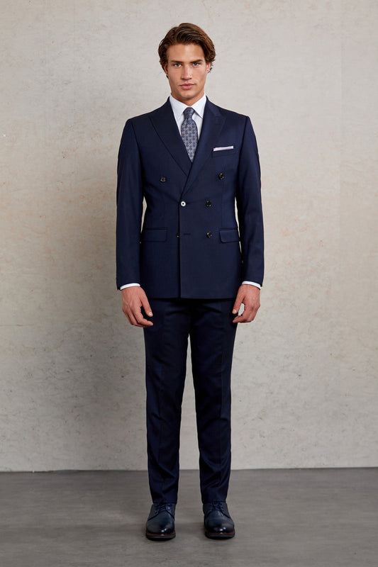 Navy blue double-breasted suit with a subtle texture and matching trousers