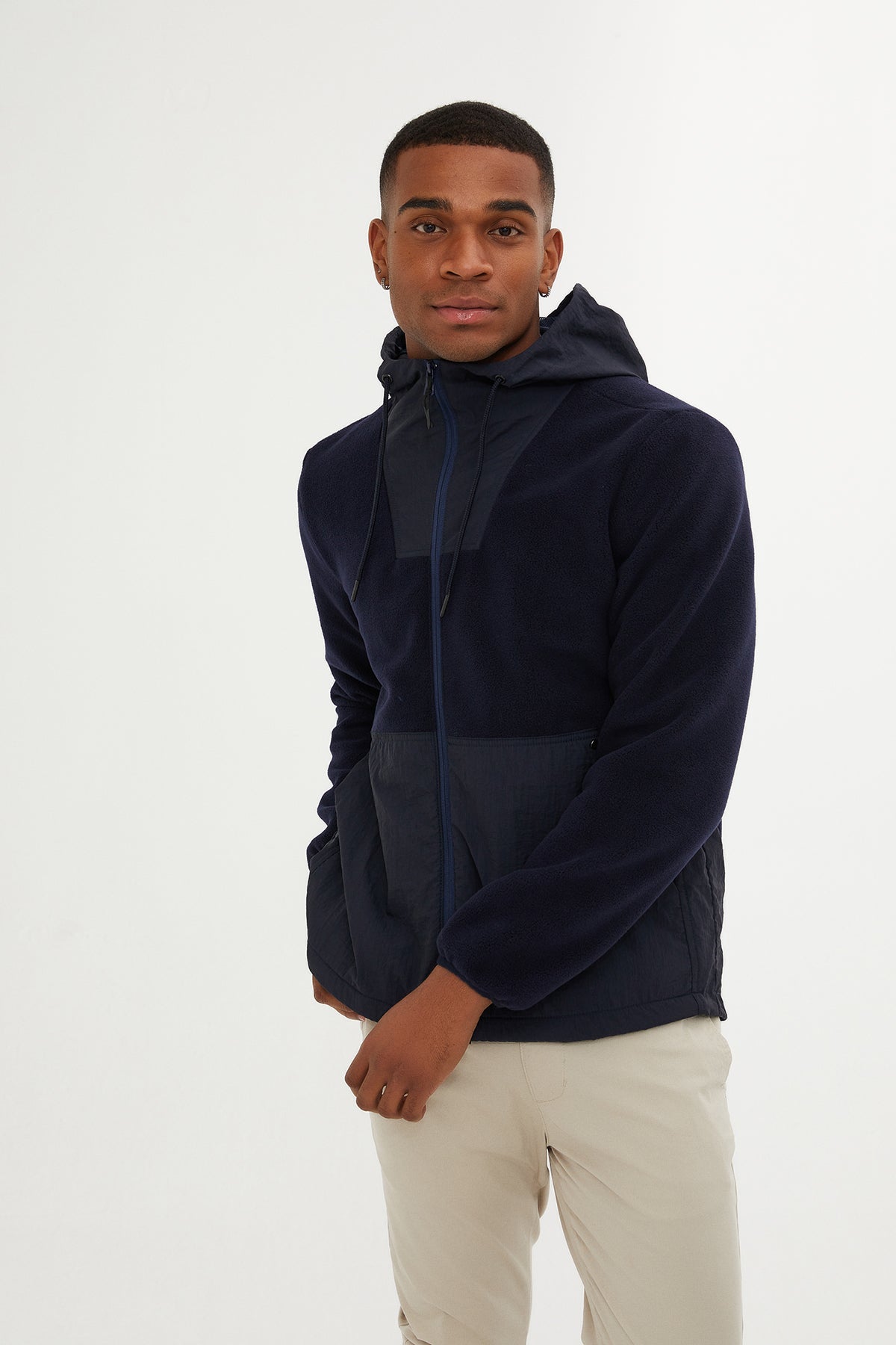 Navy blue hooded jacket with a subtle geometric panel design