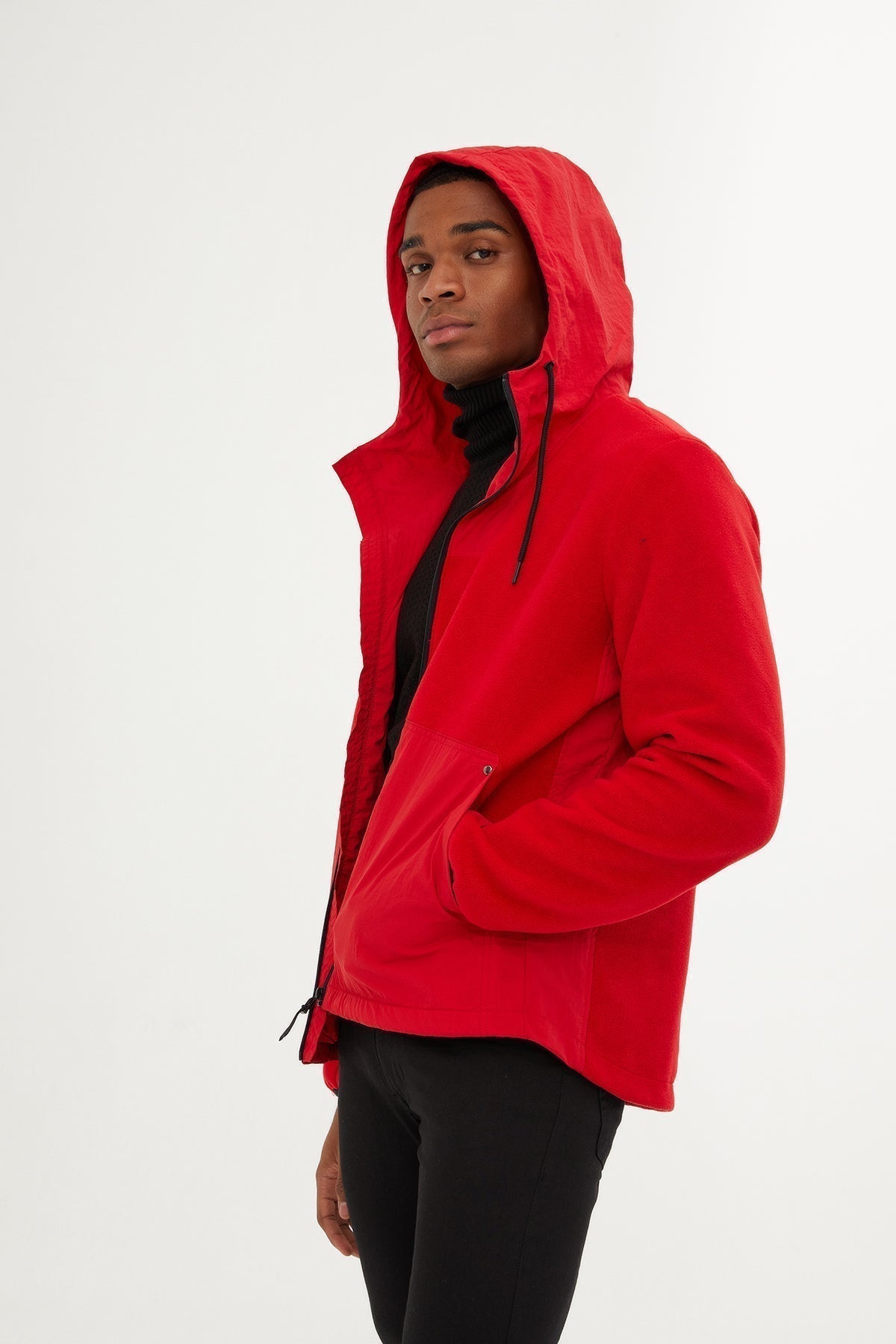 Vibrant red hooded jacket with black drawstrings and a sleek, modern design.