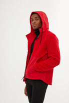 Vibrant red hooded jacket with black drawstrings and a sleek, modern design.