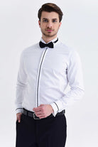 White dress shirt with black trim along the front placket and cuffs, paired with a matching bow tie.
