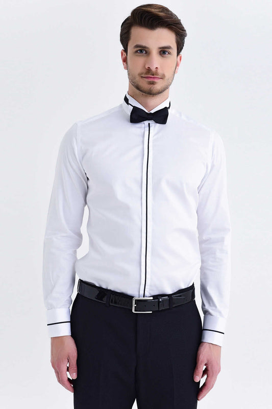 White dress shirt with black piping along the front placket and cuffs, paired with a matching black bow tie.