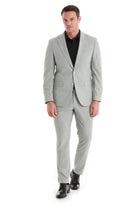 A sleek, light gray tailored suit with a classic two-button jacket and matching trousers.
