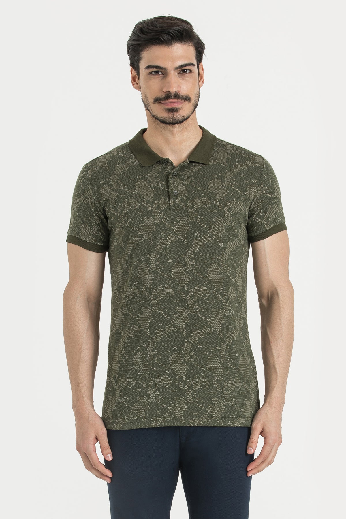Olive green polo shirt with a subtle camouflage pattern and matching collar and sleeve trim.