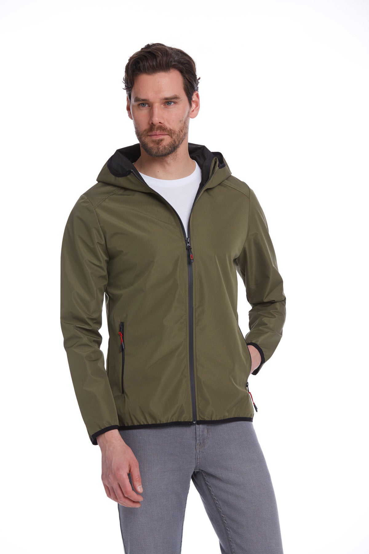 Olive green hooded jacket with black trim and red zipper pulls.