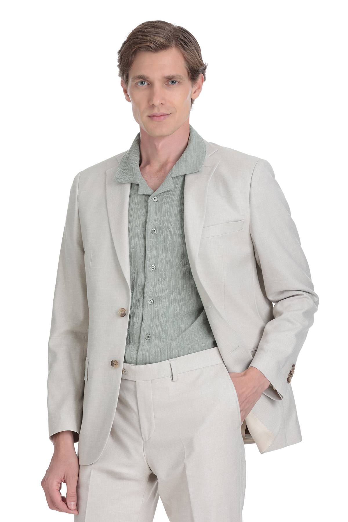 A light gray blazer with a subtle texture and matching button closure.