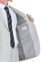 Light gray textured suit jacket with a subtle sheen, featuring a branded label inside the lining.