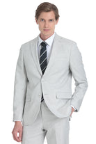 A sleek, light gray men’s suit with a tailored fit and subtle texture.