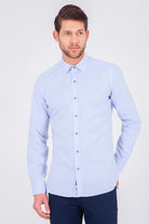 A light blue, long-sleeved men’s dress shirt with a classic collar and button-down front.