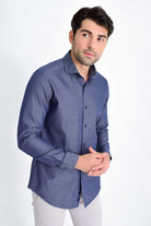 A navy blue textured button-down shirt with a classic collar and long sleeves.