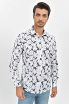 White and black monstera leaf patterned long-sleeve button-up shirt.