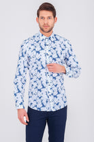 A men’s long-sleeved button-up shirt featuring a vibrant blue and white tropical leaf pattern.