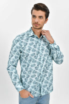Light blue long-sleeved button-up shirt with a repeating dark green fern leaf pattern.